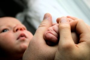 little-baby-hands-with-mom-and-dads-hands-1-1111670-m