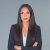 Confident professional woman in business attire conveying strong, assertive demeanor.