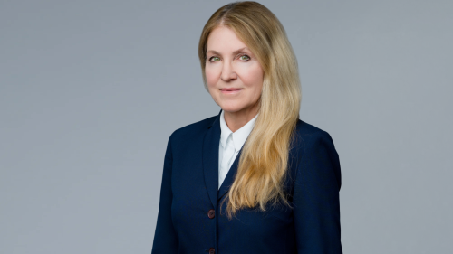Professional attorney in formal attire, displaying confidence and approachability for legal consultation.