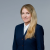 Professional attorney in formal attire, displaying confidence and approachability for legal consultation.